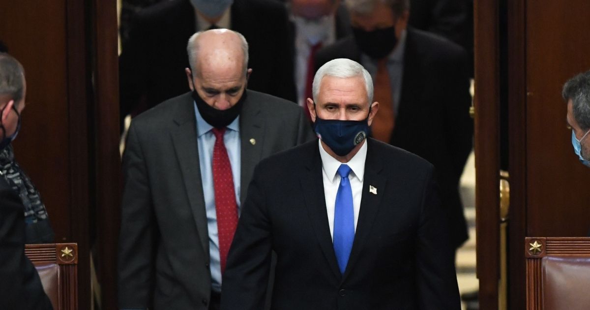 Vice President Mike Pence arrives to preside over a joint session of Congress to count the electoral votes for president after they resumed the session following protests at the U.S. Capitol in Washington, D.C., on Wednesday.