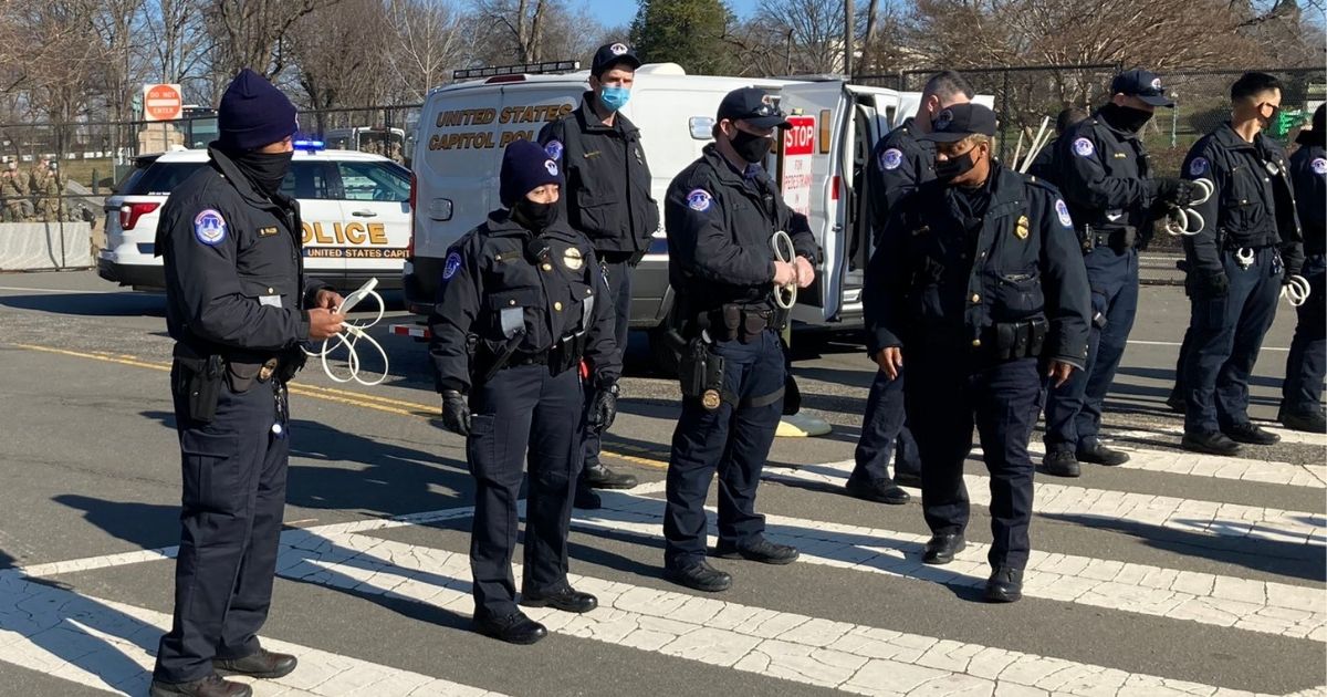 Protesters clashed with Capitol Hill police on Wednesday outside the fence that was put up last week to keep lawmakers safe during the transition of power to President-elect Joe Biden's administration.