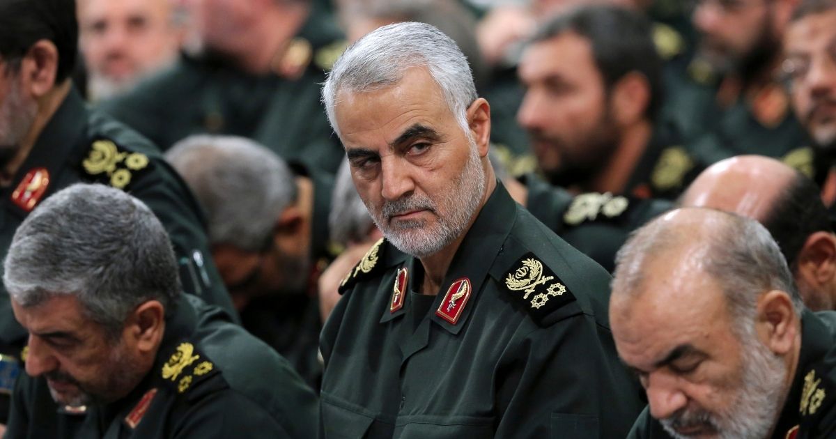 In this Sept. 18, 2016, file photo provided by an official website of the office of the Iranian supreme leader, Revolutionary Guard Gen. Qassem Soleimani, center, attends a meeting in Tehran, Iran.