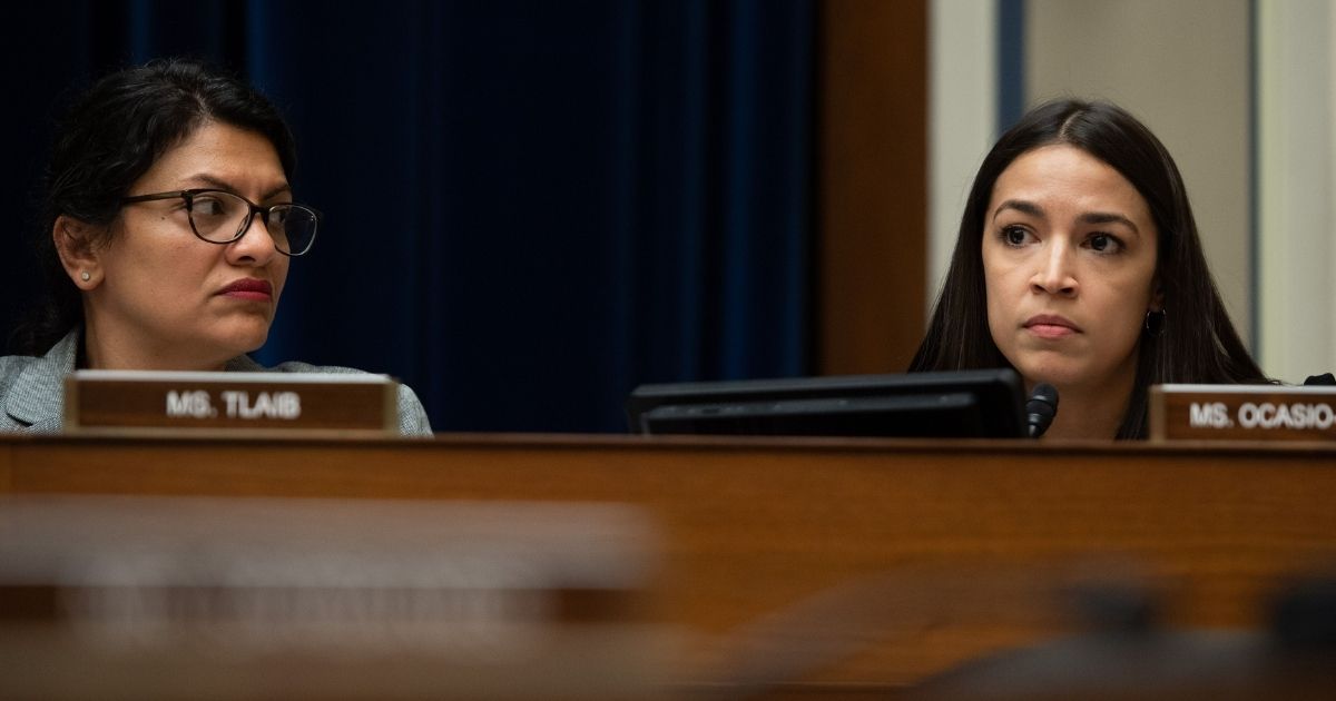 New York Democratic Rep. Alexandria Ocasio-Cortez, alongside Michigan Democratic Rep. Rashida Tlaib, left, questions Acting Secretary of Homeland Security Kevin McAleenan during a House Oversight and Reform Committee hearing on Capitol Hill in Washington, D.C., on July 18, 2019.