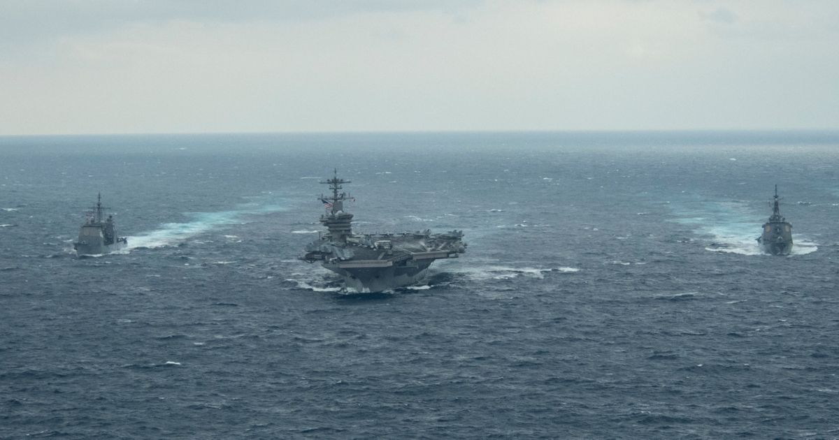 The aircraft carrier USS Theodore Roosevelt transits the Pacific Ocean on Jan. 15 with the Ticonderoga-class guided-missile cruiser USS Bunker Hill, left, and the Japanese guided-missile destroyer JS Kongo, right.