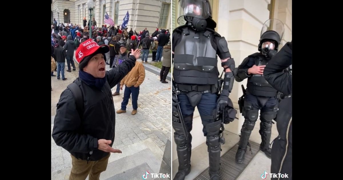 A Trump supporter yells at riot police during the Capitol incursion.