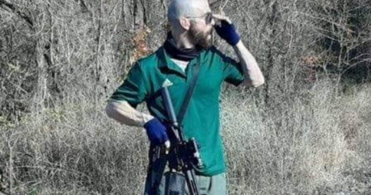 Alexander S. Contompasis, also known as Alex Stokes, posted this picture of himself on Facebook holding a rifle on Nov. 9, 2020. Below the picture are the words 'I am antifa [ominous disco music].'