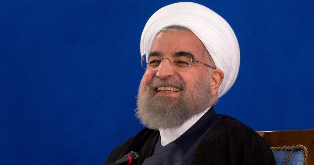 Iranian President Hassan Rouhani laughing in a 2017 file photo.