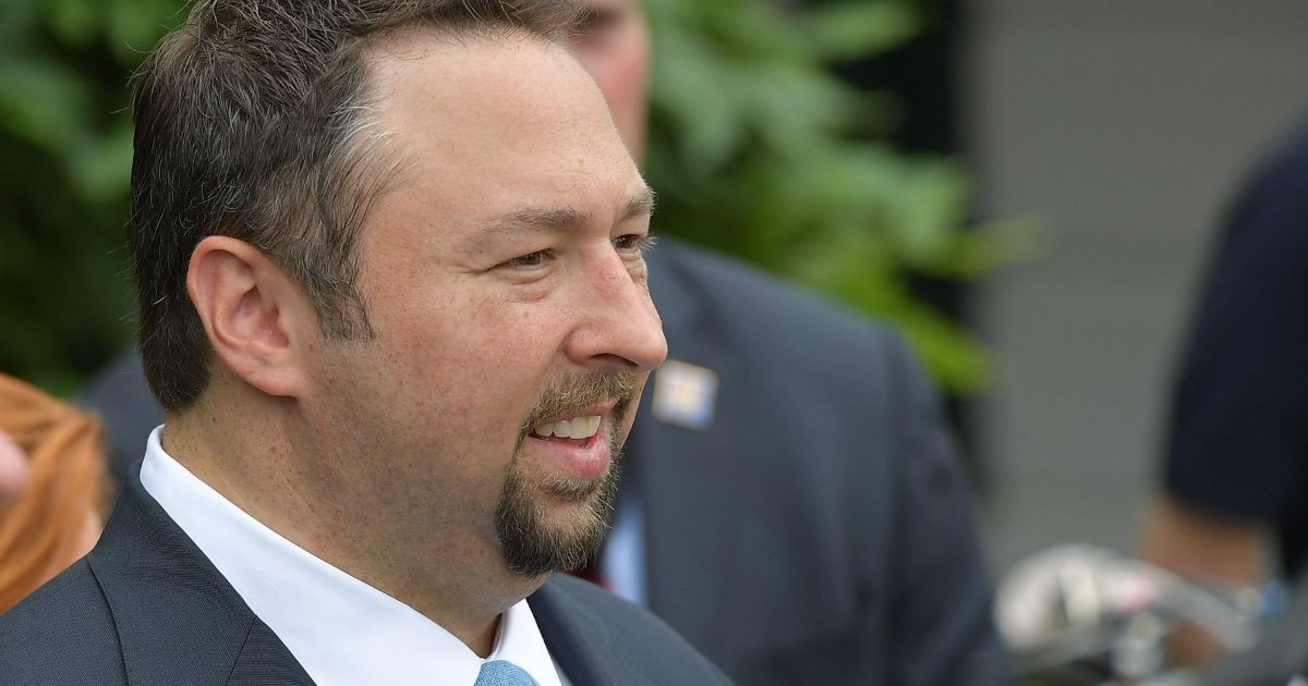 Jason Miller, a key adviser to former President Donald Trump, waits for Trump's departure on Marine One from the South Lawn of the White House on June 17, 2017.