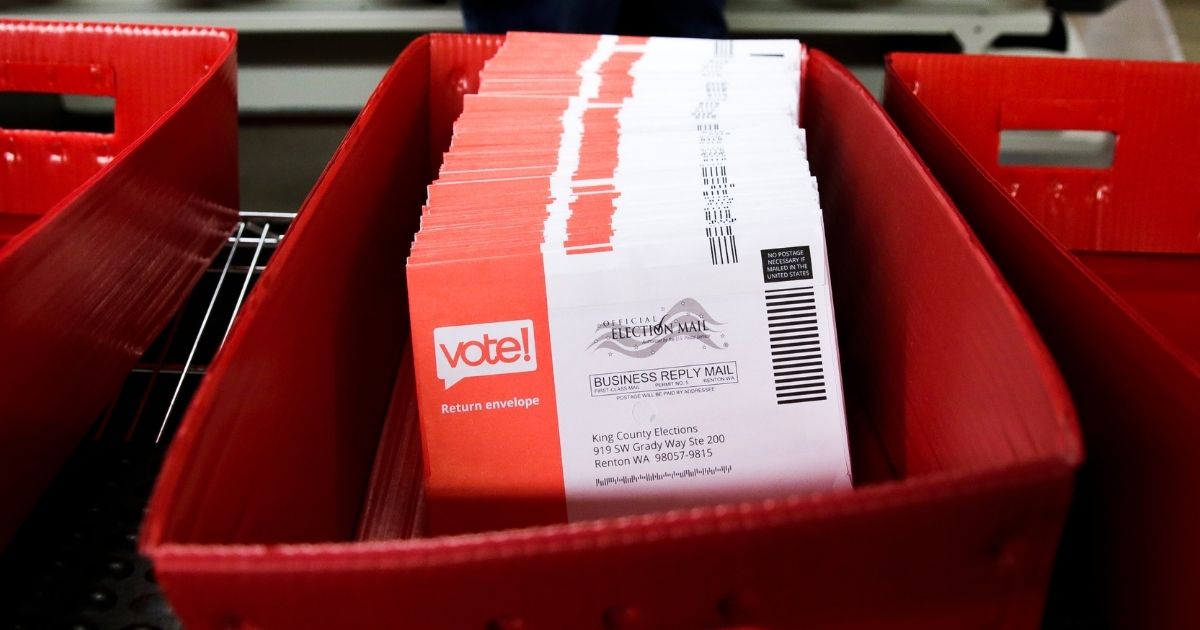 Vote-by-mail ballots are pictured being sorted on Nov. 3 in a King County, Washington, elections office in Renton.