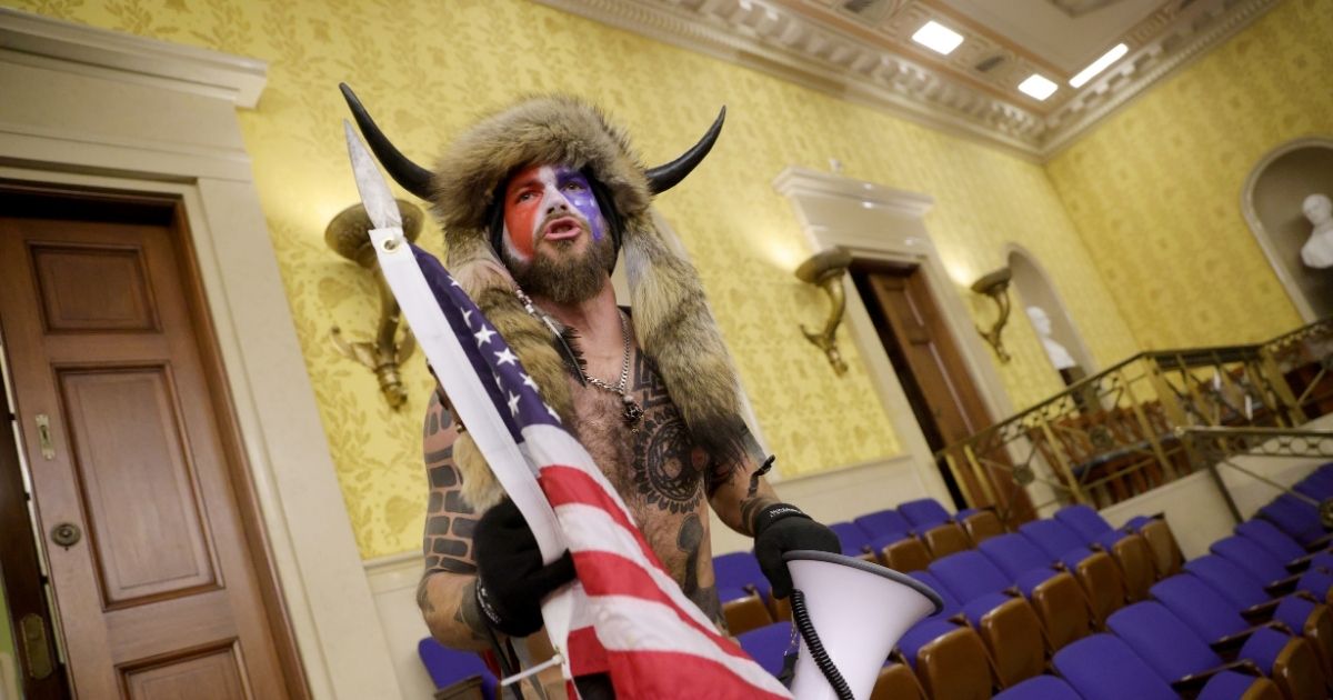 Jacob Chansley, the so-called "QAnon Shaman" is pictured inside the Capitol during the Jan. 6 incursion in Washington.