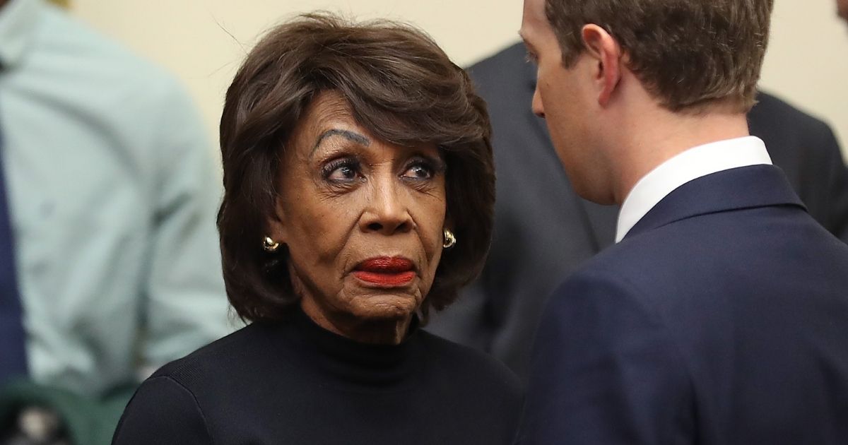 U.S. Rep. Maxine Waters is pictured in a file photo from October 2019 talking to Facebook CEO Mark Zucker after a hearing on political content on the social media giant.