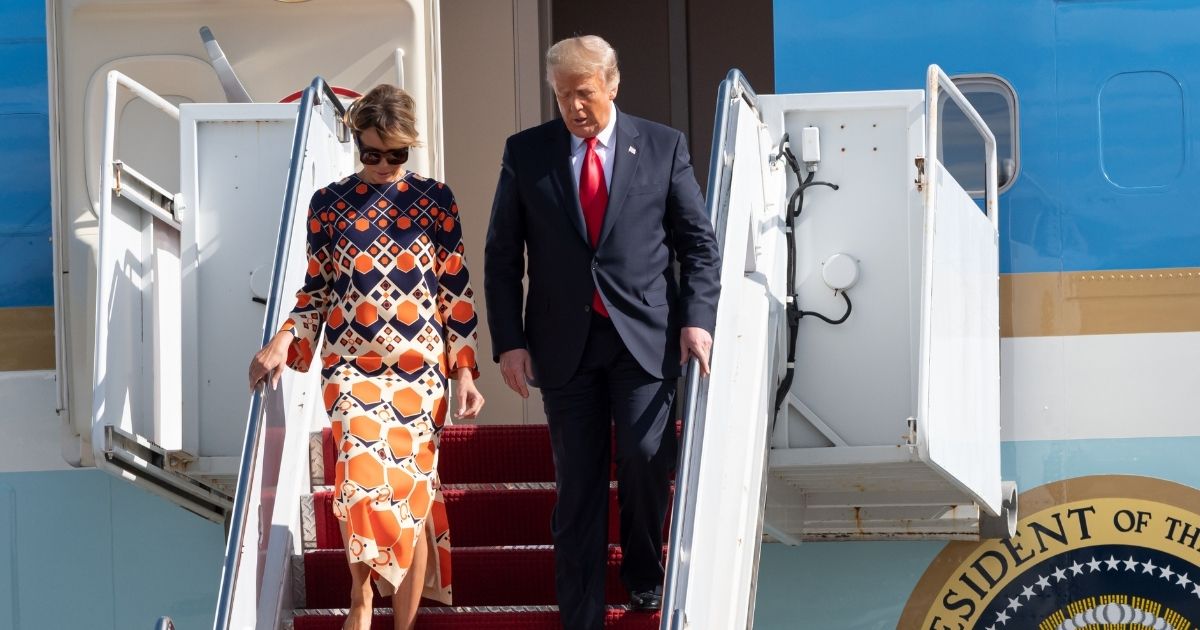Then-President Donald Trump and first lady Melania Trump disembark Air Force One on Jan. 20 at Florida's Palm Beach International Airport.