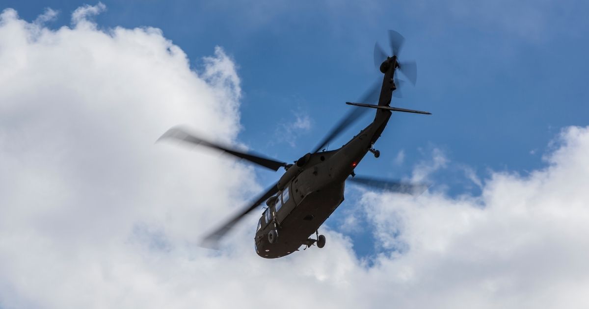 A Black Hawk helicopter flies in this stock image.