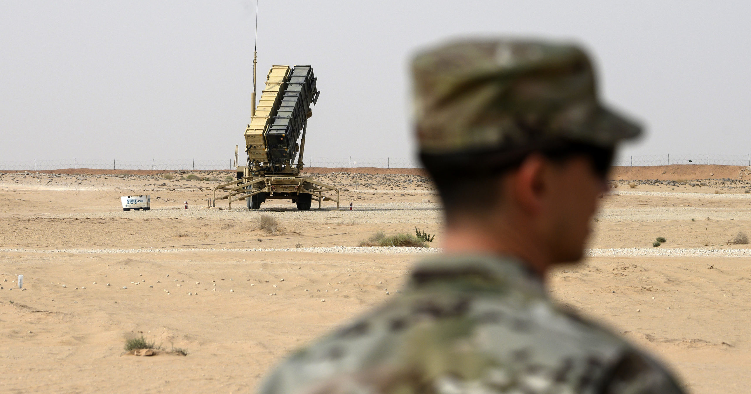 A member of the U.S. Air Force stands near a missile battery at the Prince Sultan Air Base in al-Kharj, Saudi Arabia, on Feb. 20, 2020.