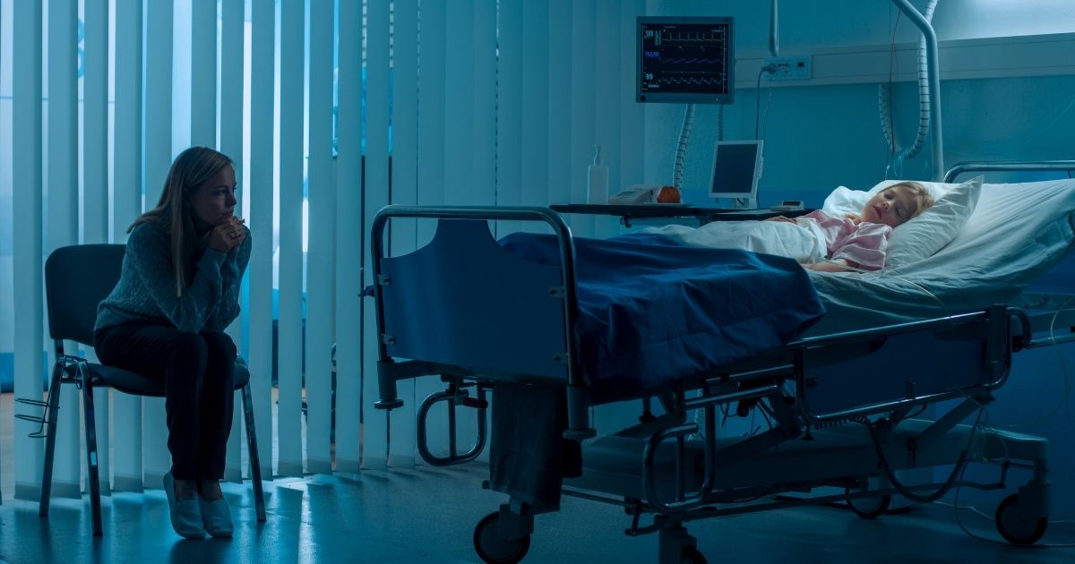 The above stock photo shows a girl lying in a hospital bed. On Thursday, a 10-year-old in Italy was declared brain dead after participating in a dangerous TikTok challenge.