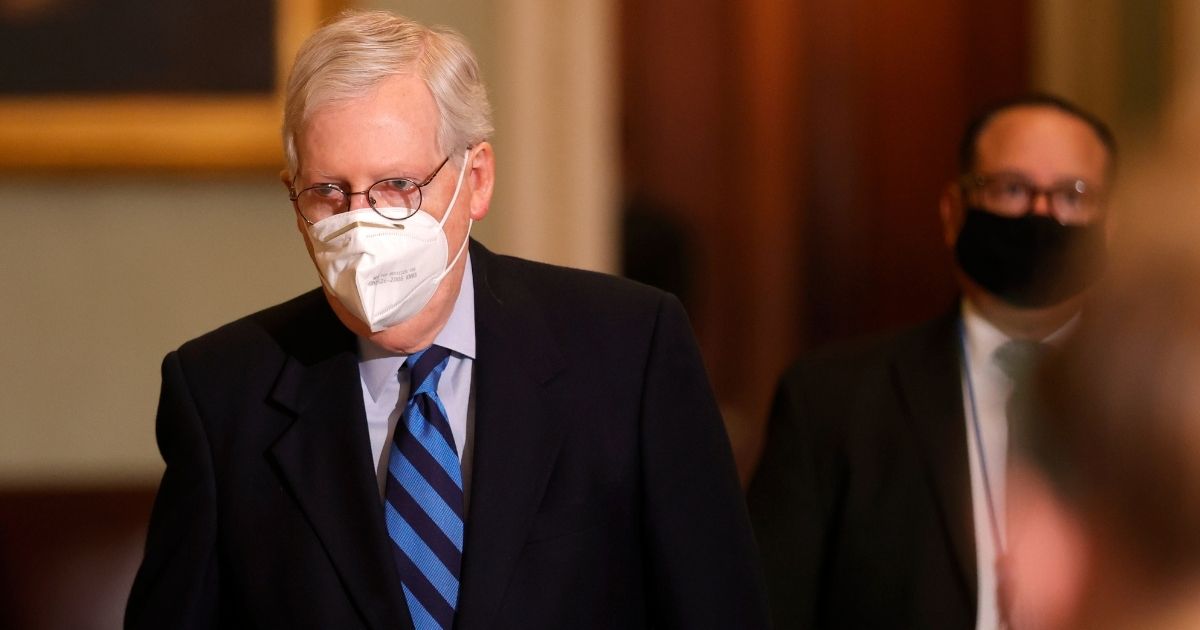 Senate Majority Leader Mitch McConnell leaves the Senate chamber on Jan. 19, 2021, in Washington, D.C.