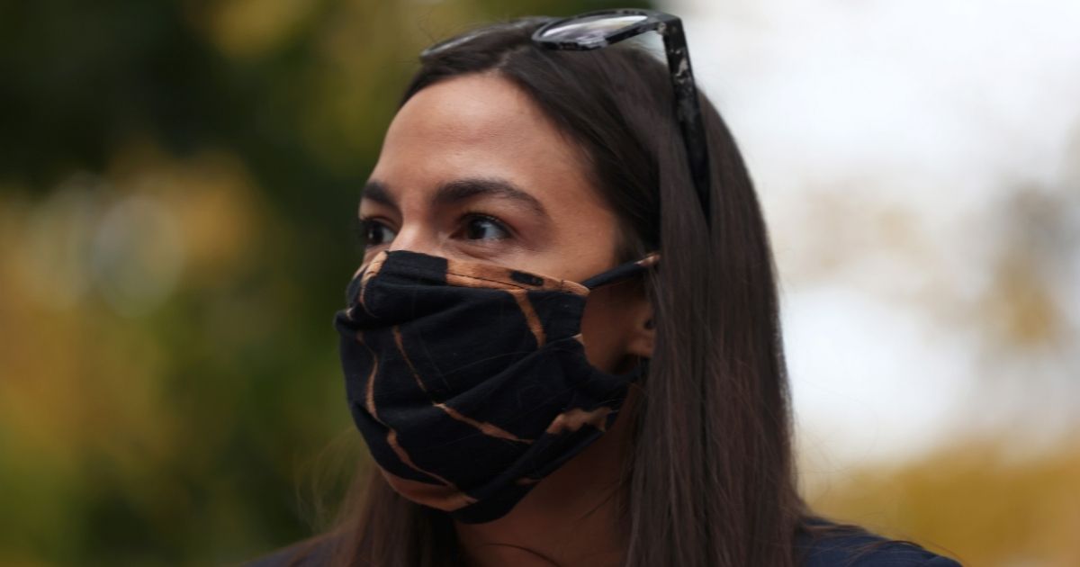 New York Democratic Rep. Alexandria Ocasio-Cortez looks out toward a crowd during a food distribution event on Oct. 27, 2020, in New York City.