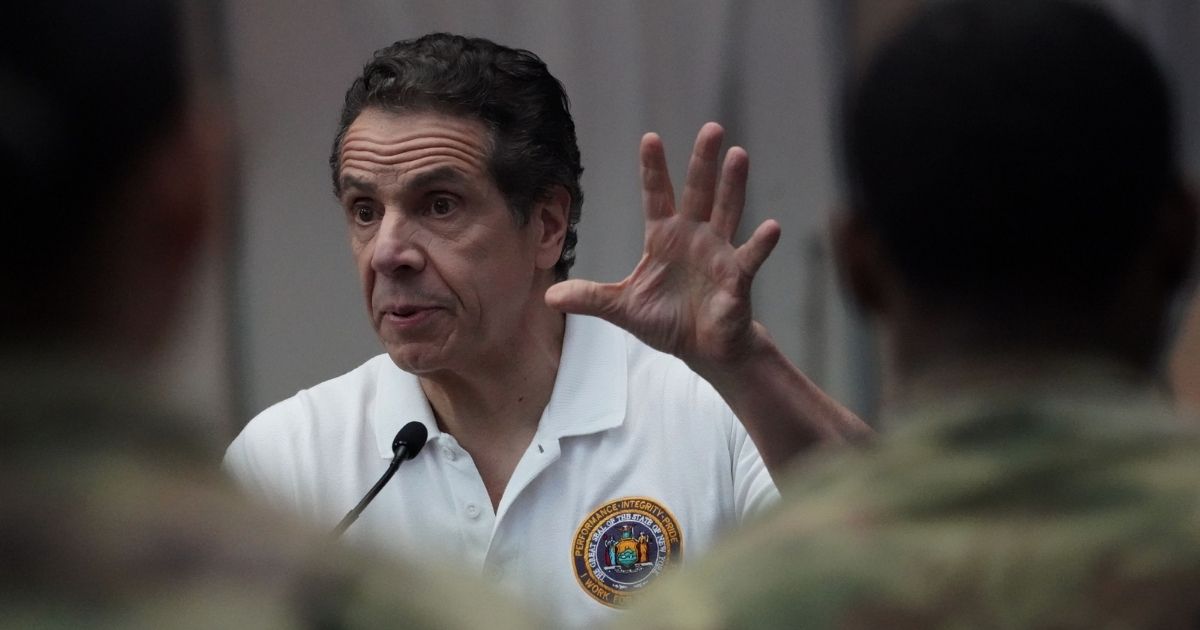 National Guard troops listen as New York Gov. Andrew Cuomo speaks to the media at the Jacob K. Javits Convention Center in New York City on March 27, 2020.