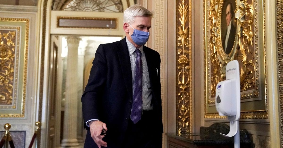 Republican Louisiana Sen. Bill Cassidy walks on Capitol Hill after the Senate acquitted former President Donald Trump in his second impeachment trial in the Senate at the U.S. Capitol in Washington on Saturday.