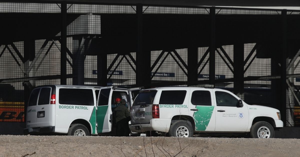 Border Patrol agents detain migrants who crossed the Rio Grande natural border between El Paso, Texas, and Ciudad Juarez, Mexico, on Jan. 26.