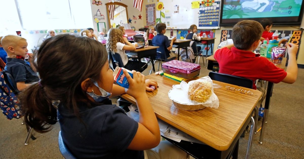 A student eats lunch in her classroom at Freedom Preparatory Academy in Provo, Utah, on Sept. 10.