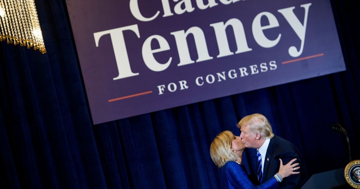 Then-President Donald Trump kisses then-New York GOP Rep. Claudia Tenney during a fundraiser on Aug. 13, 2018, in Utica, New York.