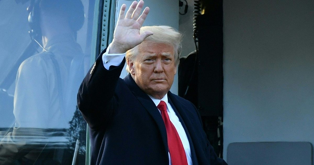 Outgoing President Donald Trump waves as he boards Marine One at the White House in Washington, D.C, on Jan. 20, 2021.