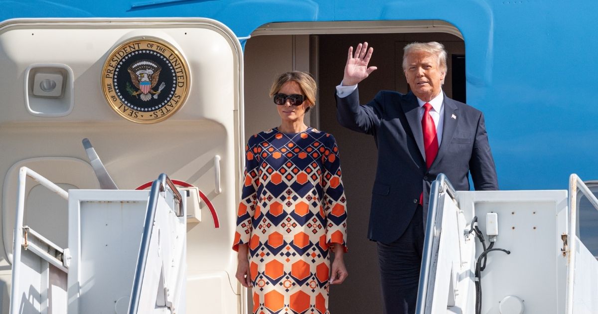 Outgoing U.S. President Donald Trump and First Lady Melania Trump exit Air Force One at the Palm Beach International Airport on the way to Mar-a-Lago Club on Jan. 20 in West Palm Beach, Florida.