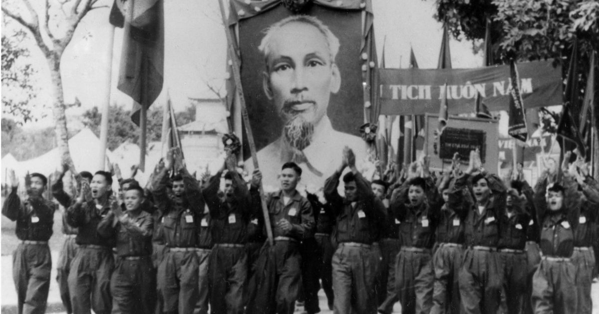 Uniformed students carry a portrait of Vietnamese President Ho Chi Minh during parade in Hanoi, Vietnam, in 1965.