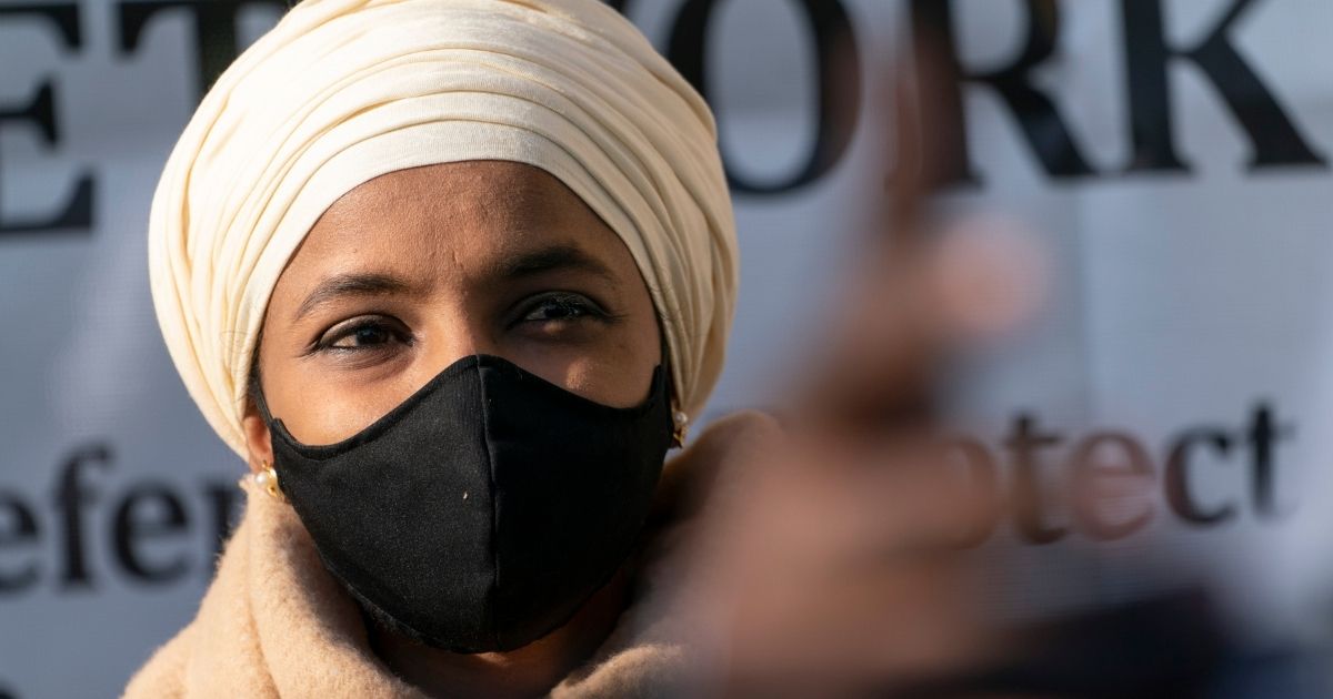 Minnesota Democratic Rep. Ilhan Omar listens during an event Nov. 19, 2020, outside the Democratic National Committee Headquarters in Washington.