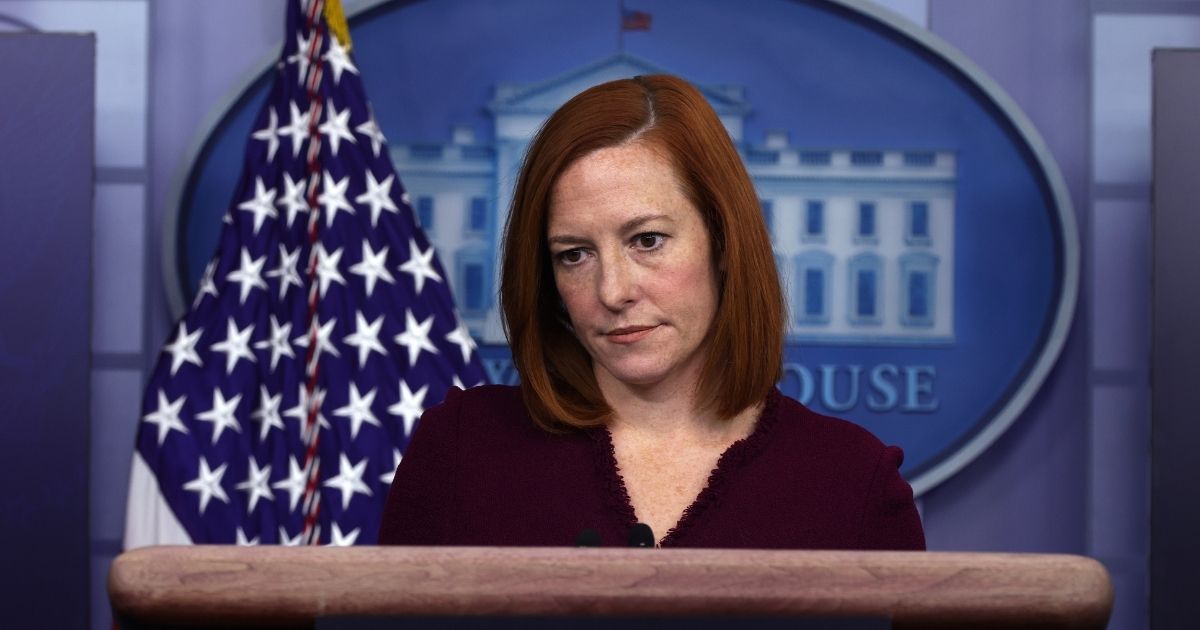 Jen Psaki listens during a news conference