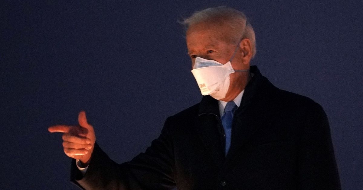 President Joe Biden gestures as he boards Air Force One before departing from Andrews Air Force Base in Maryland on Friday.