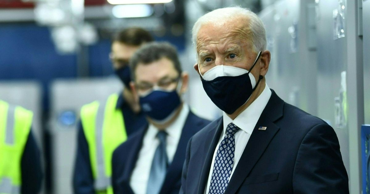 President Joe Biden speaks as he tours COVID-19 vaccine freezers at a Pfizer manufacturing site in Kalamazoo, Michigan, on Friday.