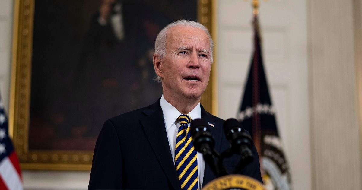 President Joe Biden speaks at an event to sign an executive order on the economy with Vice President Kamala Harris on Wednesday in the State Dining Room of the White House in Washington, D.C.