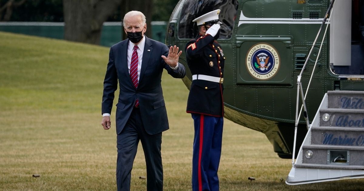 President Joe Biden waves as he exits Marine One on the South Lawn of the White House on Friday in Washington, D.C.