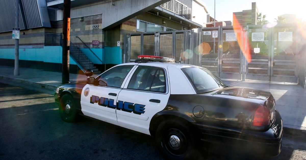 A police car is parked outside of the Miguel Contreras Learning Complex, a high school in the Westlake neighborhood of Los Angeles, on Dec. 15, 2015.