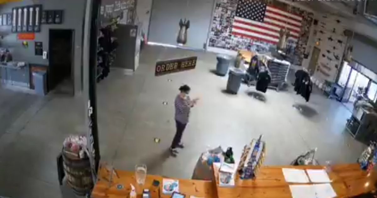 A security camera captures footage of an LA County health inspector dancing after telling an employee at a local brewery the business must shut down on Feb. 7, 2021.