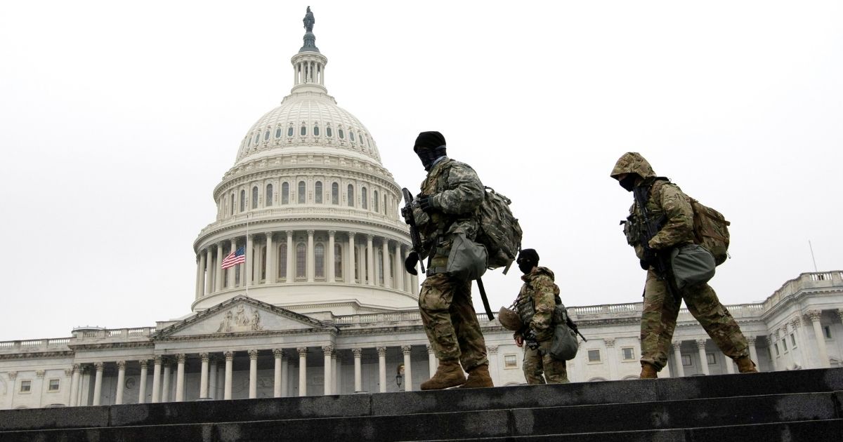 National Guard troops patrol the area around the U.S. Capitol in Washington on Thursday.