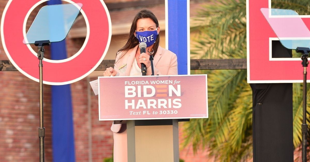 Florida Commissioner of Agriculture and Consumer Services Nikki Fried speaks at a 'Women for Biden' drive-in rally at Century Village in Boca Raton on Oct. 5, 2020, in Boca Raton, Florida.