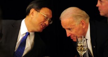 Yang Jiechi, left, then China's foreign minister, has a word with then-Vice President Joe Biden during a luncheon in Los Angeles on Feb. 17, 2012.