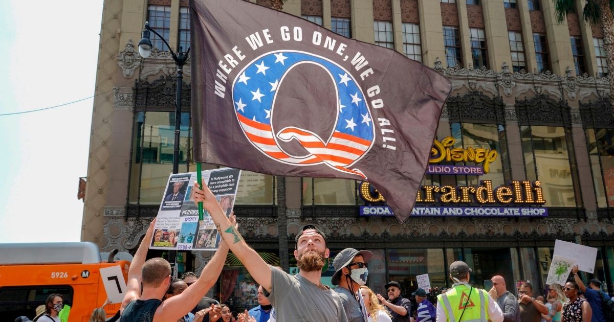 QAnon demonstrators protest child sex trafficking on Hollywood Boulevard in Los Angeles on Aug. 22.