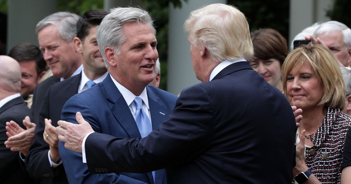 Then-President Donald Trump, right, greets Rep. Kevin McCarthy of California during a GOP event at the White House Rose Garden on May 4, 2017.