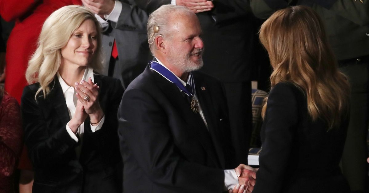 Radio personality Rush Limbaugh reacts after former first lady Melania Trump gives him the Presidential Medal of Freedom during the State of the Union address in the chamber of the U.S. House of Representatives on Feb. 4, 2020, in Washington, D.C.