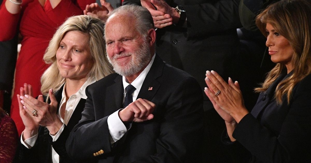 Talk radio icon Rush Limbaugh pumps his fist as he is acknowledged by then-President Donald Trump during the State of the Union address at the U.S. Capitol in Washington on Feb. 4, 2020.