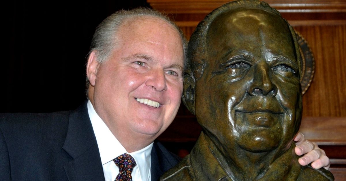 Conservative talk radio icon Rush Limbaugh poses with a bust in his likeness during a ceremony inducting him into the Hall of Famous Missourians in the state Capitol in Jefferson City on May 14, 2012.