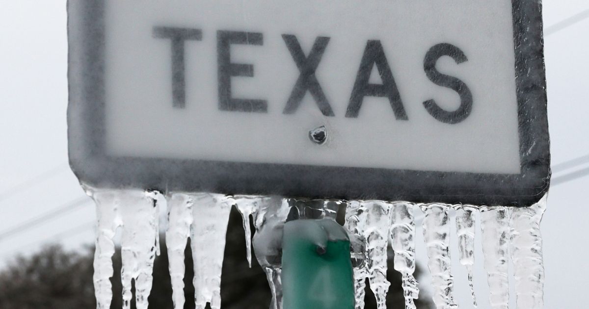 Icicles hang off a State Highway 195 sign in Killeen, Texas, on Thursday.