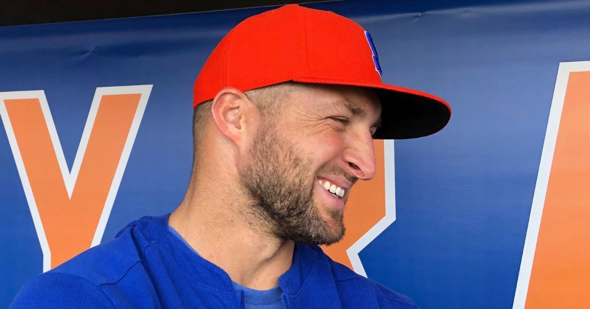 Tim Tebow speaks with reporters prior to a Syracuse Mets minor league game on May 16, 2019.