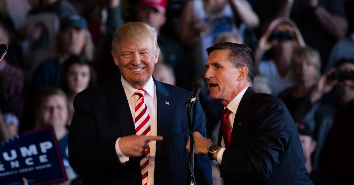 Trump and Flynn at a podium at a rally