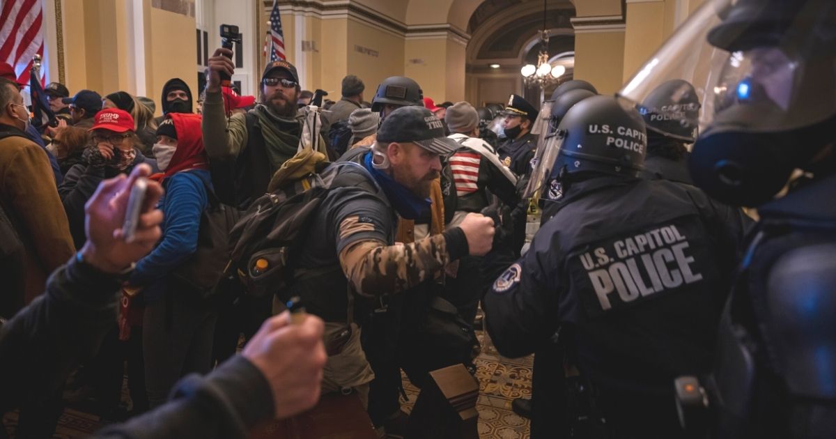 Supporters of then-President Donald Trump face off with Capitol Police officers after entering the Capitol Jan. 6.