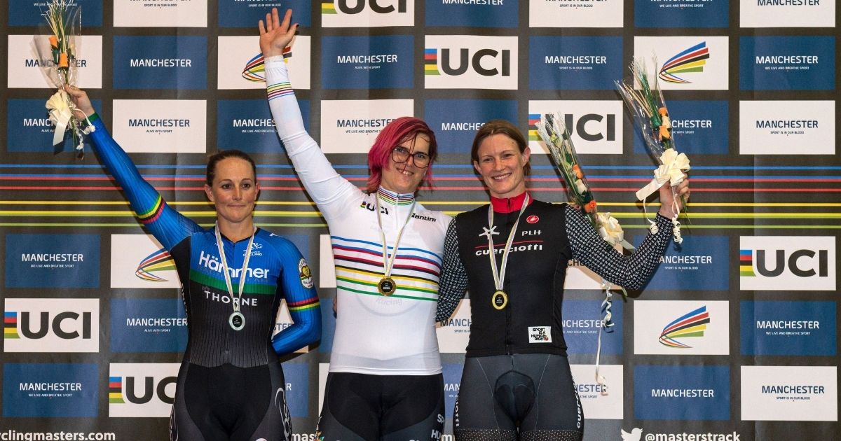 Transgender Canadian cyclist Rachel McKinnon, center, celebrates his gold medal on the podium with bronze medalist Kirsten Herup Sovang, right, of Denmark and silver medalist Dawn Orwick, left, of the United States, at the UCI Masters Track Cycling World Championships in Manchester, England, on Oct. 19, 2019.