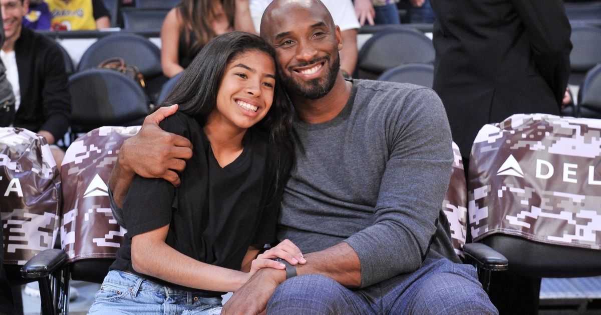 Kobe Bryant and his daughter Gianna attend a basketball game between the Los Angeles Lakers and Atlanta Hawks at Staples Center in Los Angeles on Nov. 17, 2019. The two died, along with seven others, in a helicopter crash in Southern California on Jan. 26, 2020.
