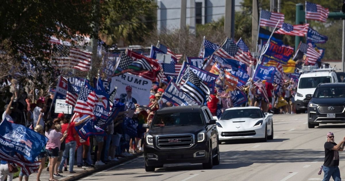 Supporters of former President Donald Trump stage a Presidents Day rally Monday near Trump's Mar-a-Lago home in West Palm Beach, Florida.
