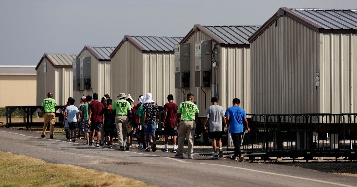In a July 2019 file photo, illegal immigrant children are escorted to class at the detention center in Carrizo Springs, Texas.